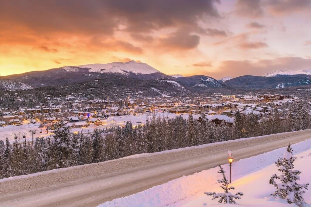 glow over the snowy village of Breckenridge in colorado