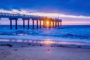 long pier into the atlantic ocean at sunrise in st augustine