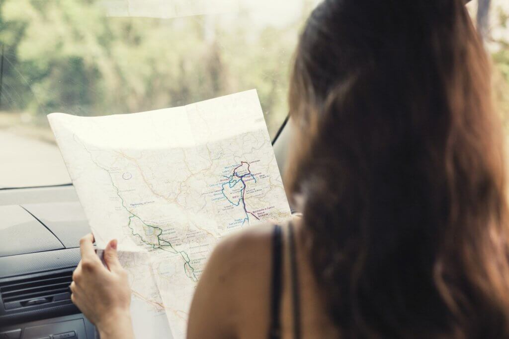 a woman looking at a map